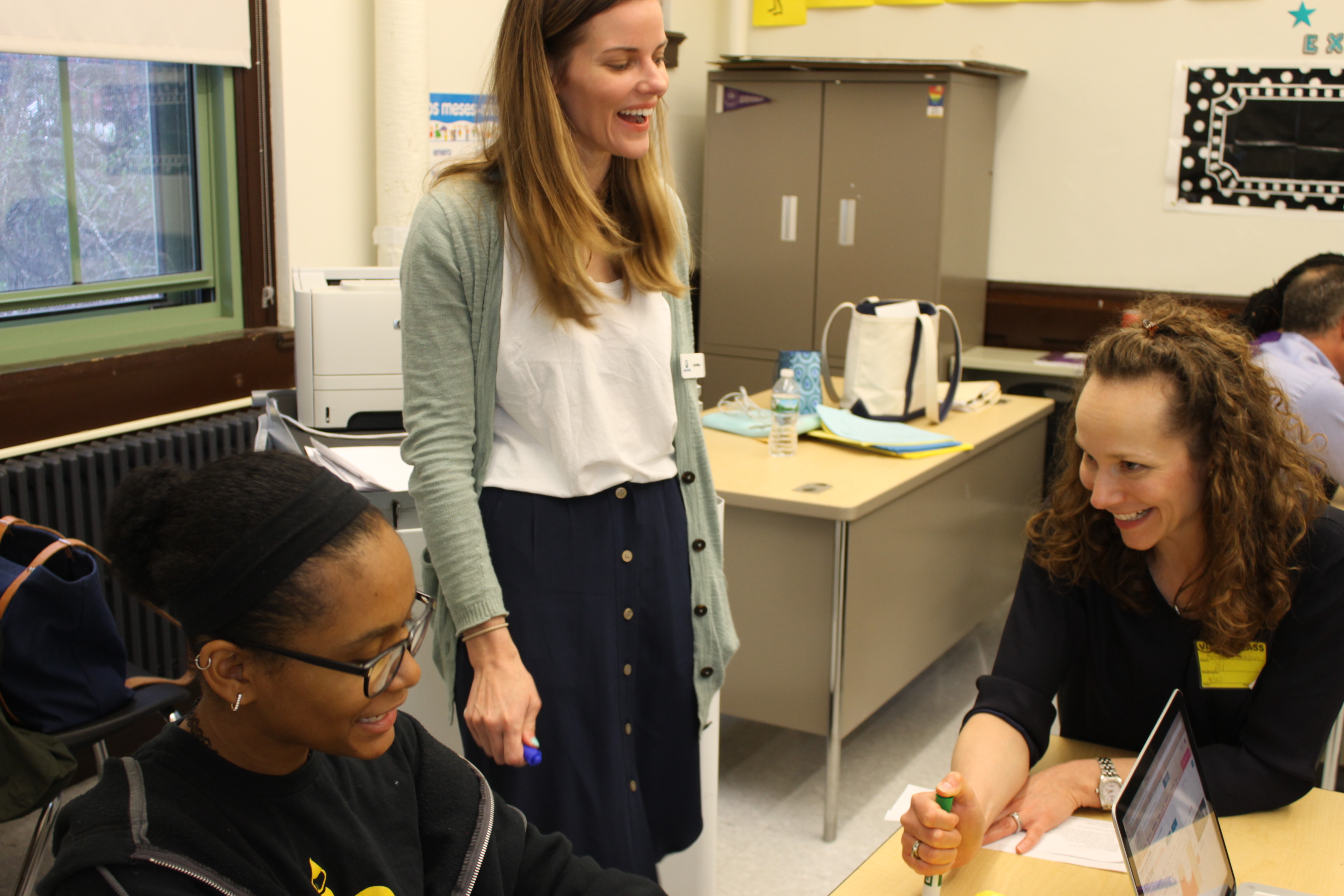 A teacher working with students